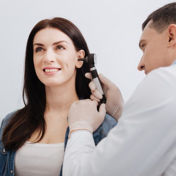 woman-smiling-at-her-professional-hearing-examination